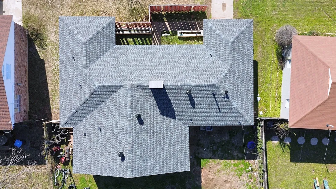 A gray shingle roof around a small back courtyard, from directly above